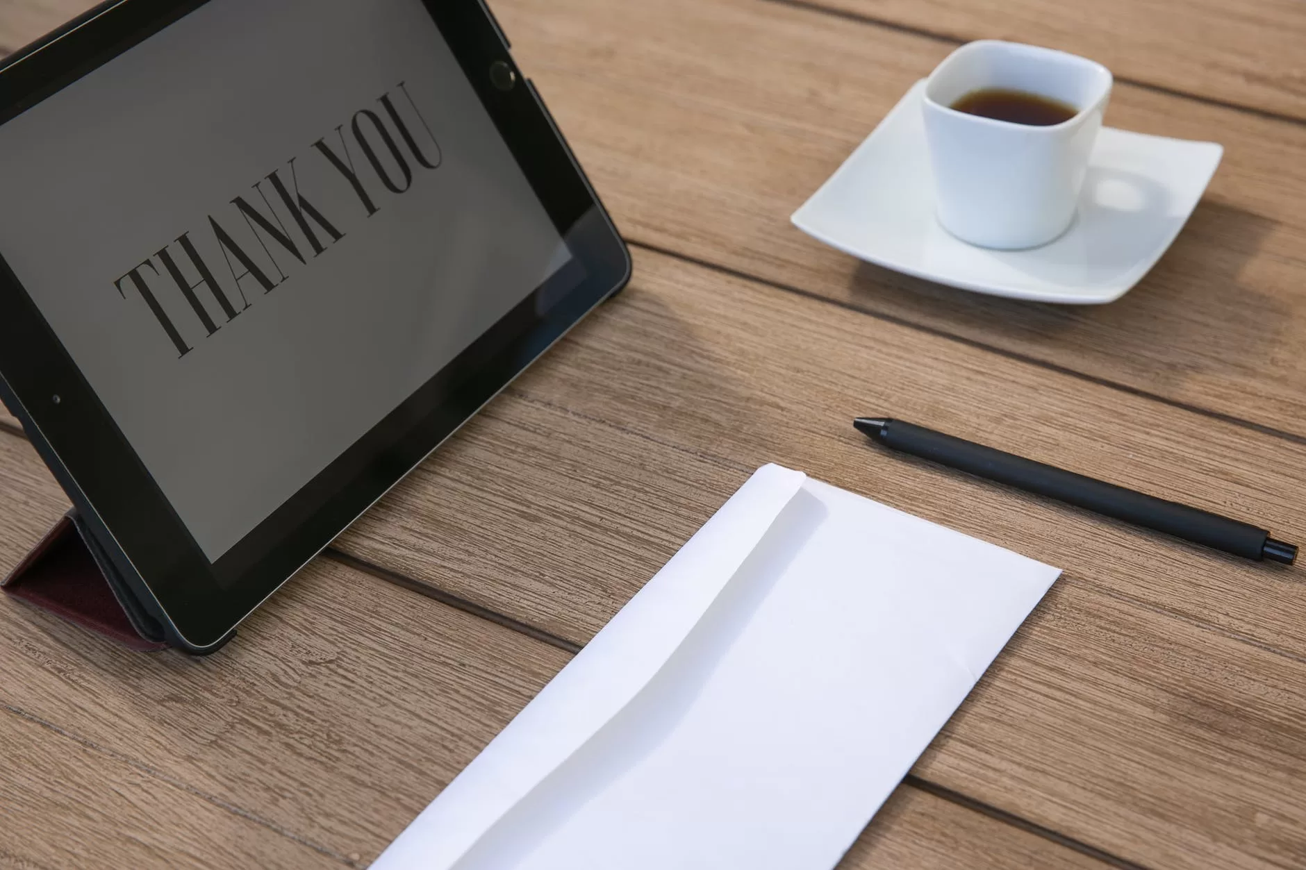 an notepad with thank you text on the screen